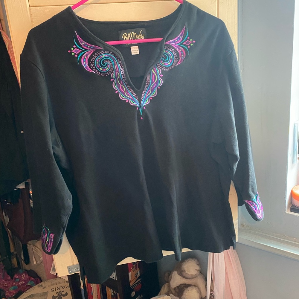Black mid sleeve top with embroidered purple and blue thread